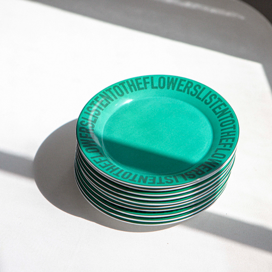 GREEN CERAMIC PLATES STACKED