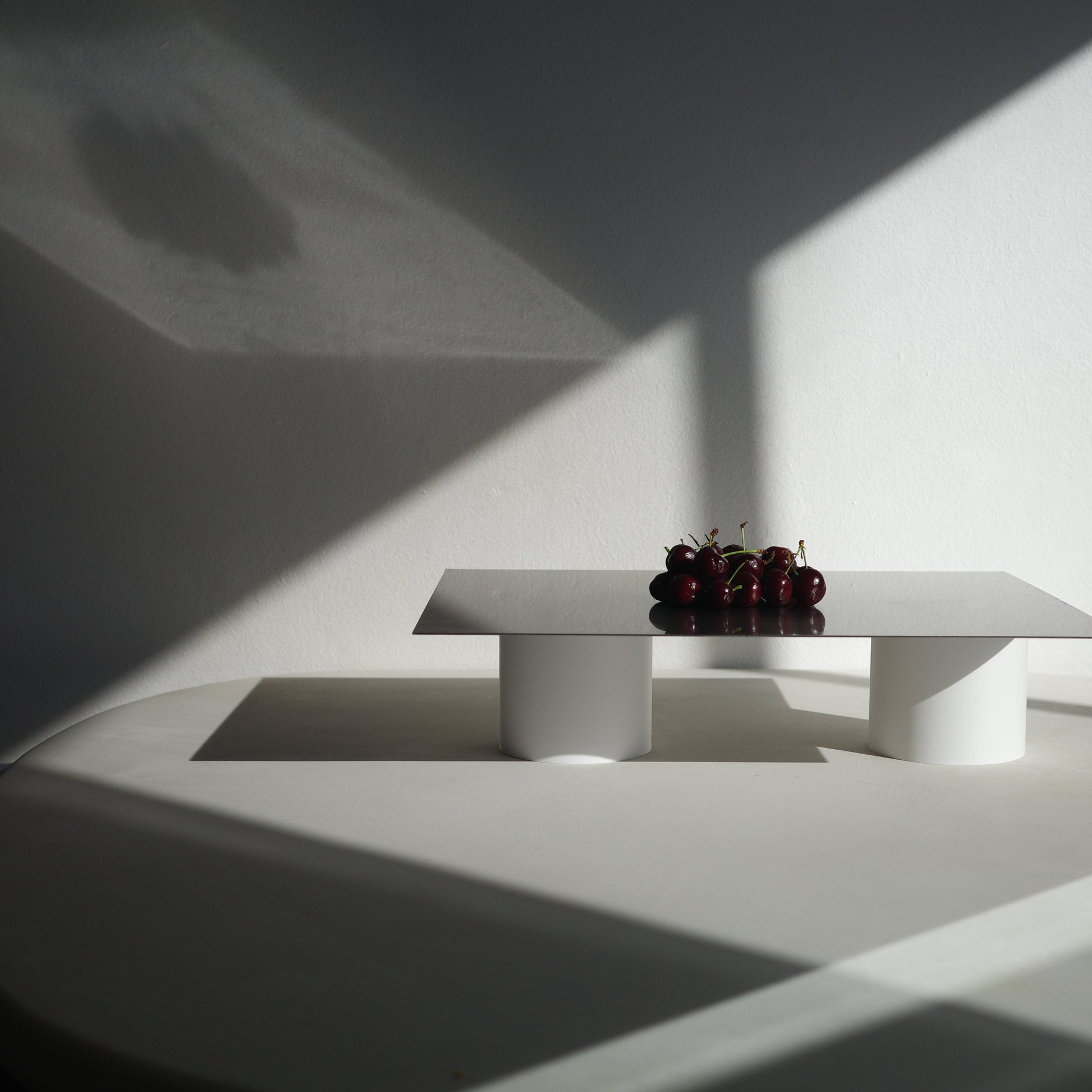 stainless steel serving board with cherries