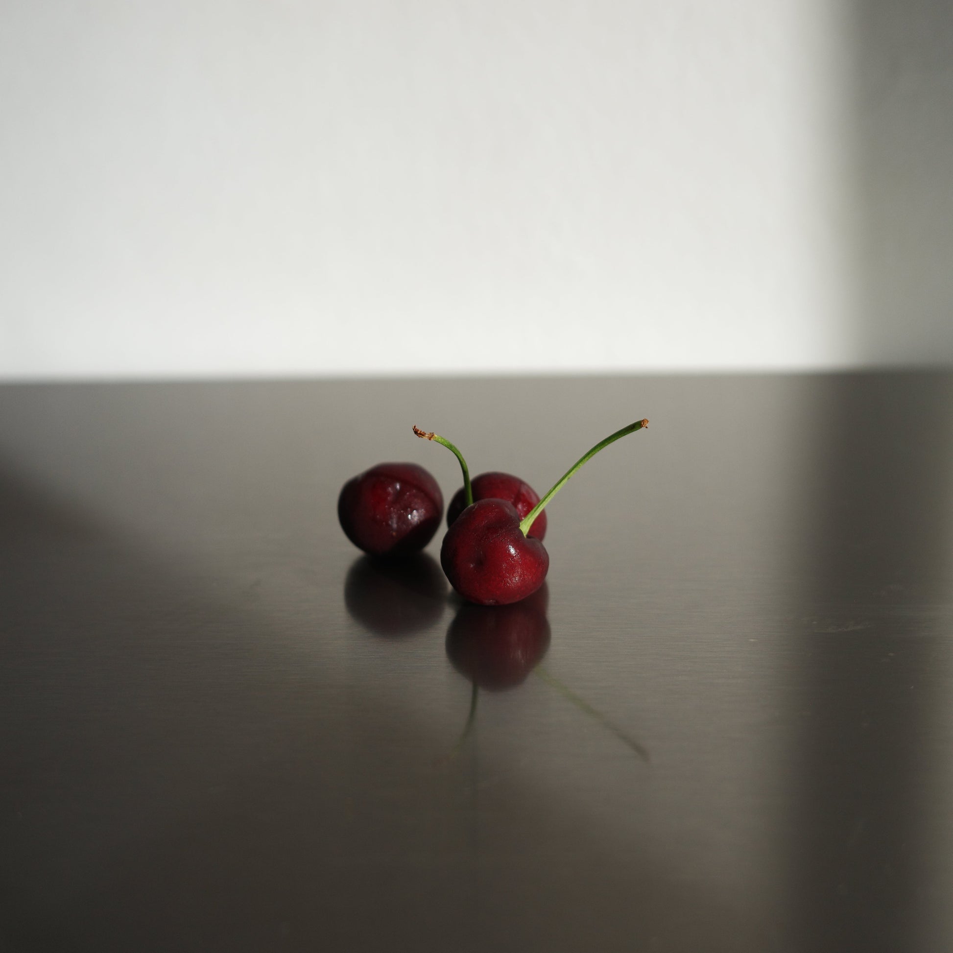 stainless steel serving board with cherries