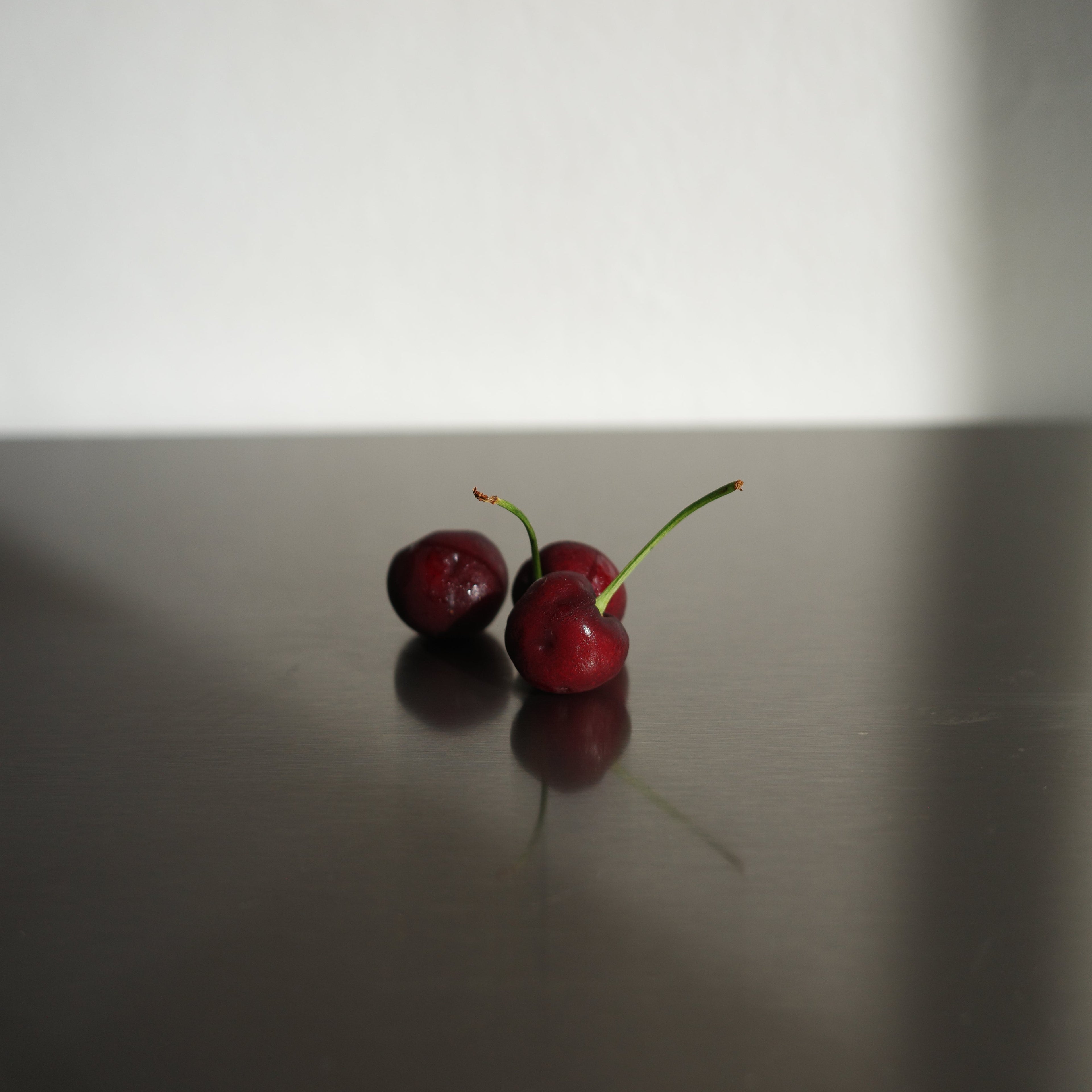 stainless steel serving board with cherries