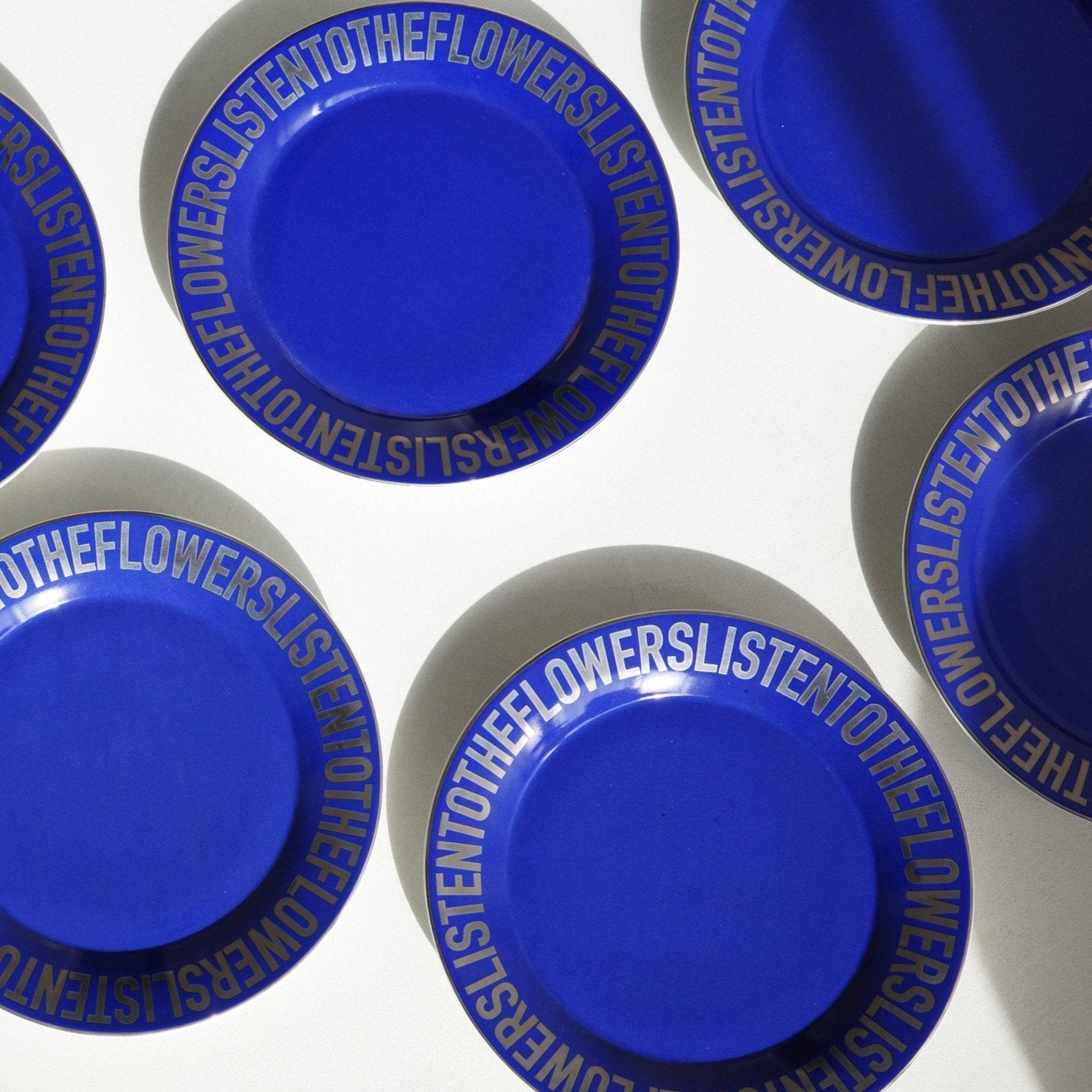 BLUE CERAMIC PLATES WITH CHROME LETTERING