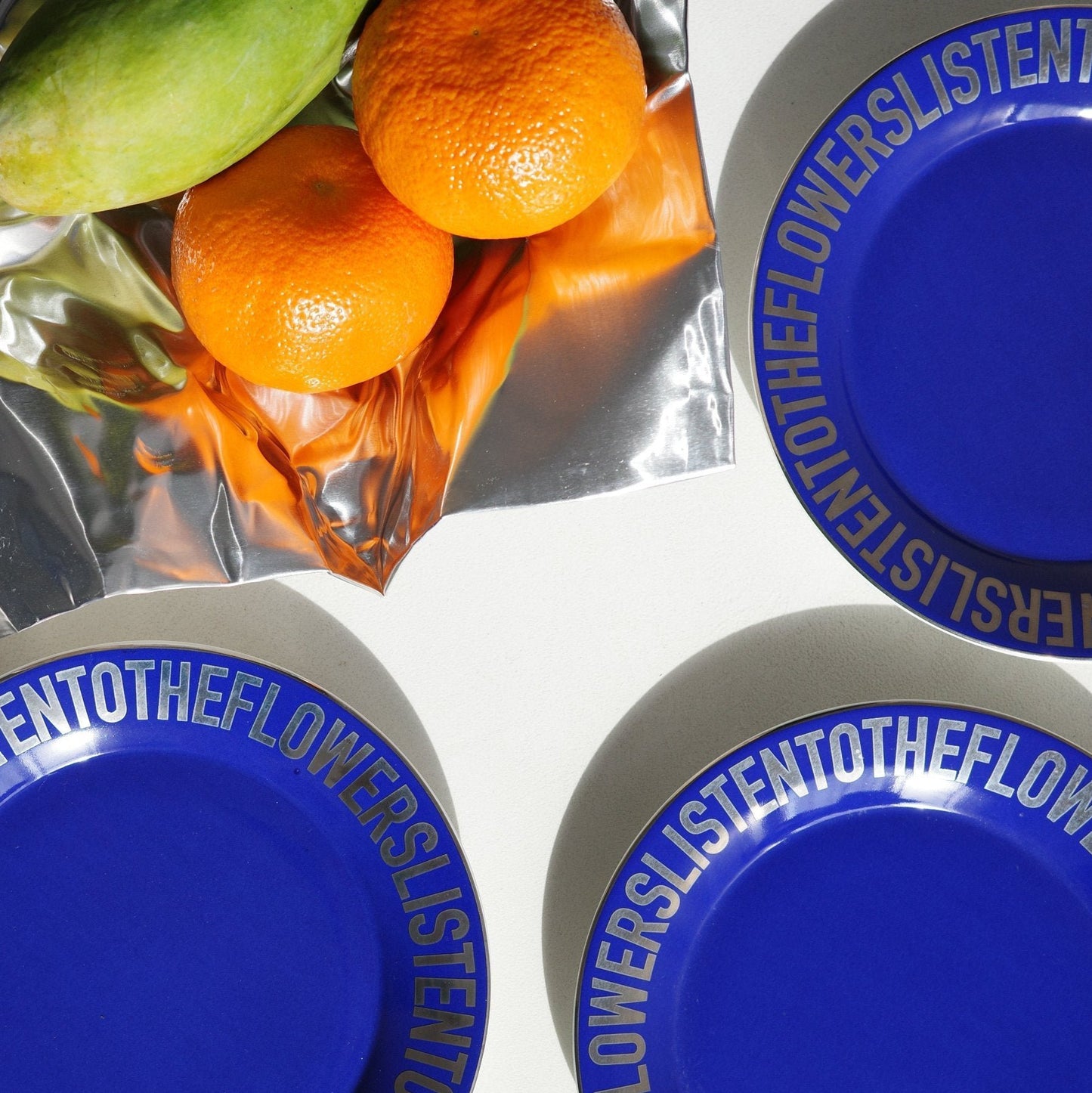 DARK BLUE CERAMIC PLATE  WITH CHROME LETTERING AND WITH FRUIT BOWL