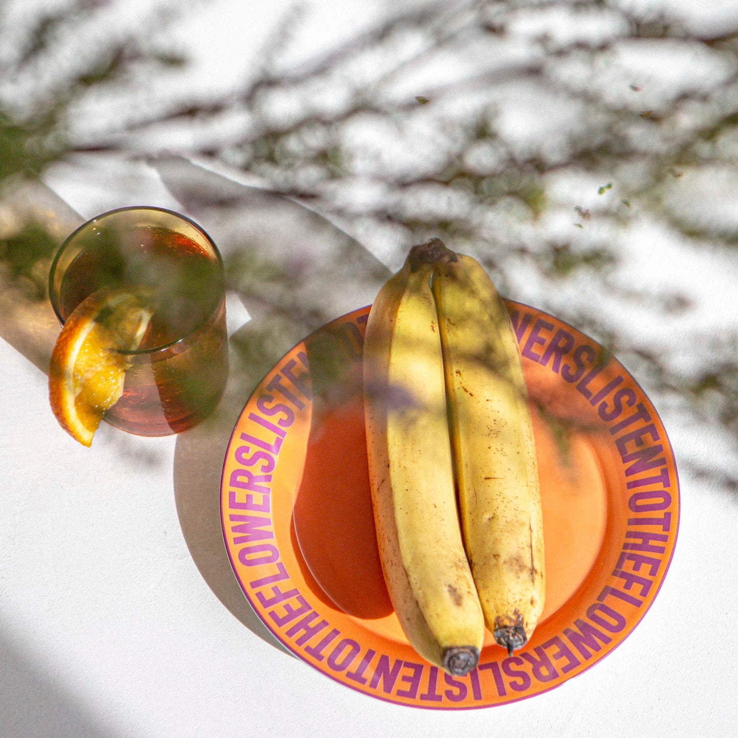 ORANGE CERAMIC PLATE WITH BANANAS