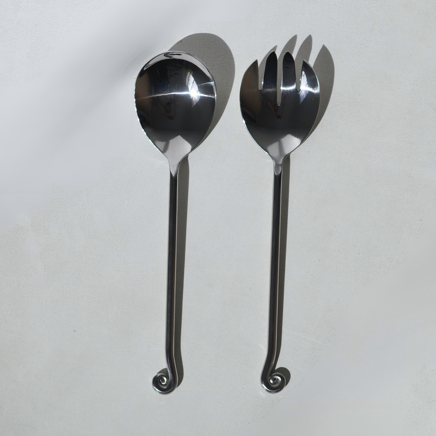 Stainless steel salad servers with a spiral twisted end