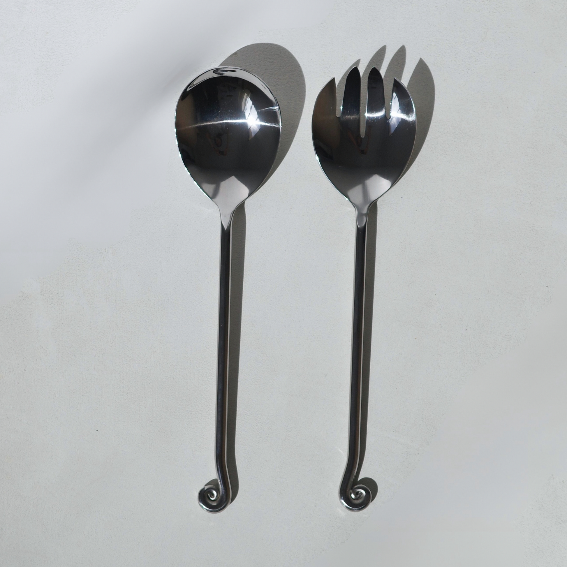 Stainless steel salad servers with a spiral twisted end