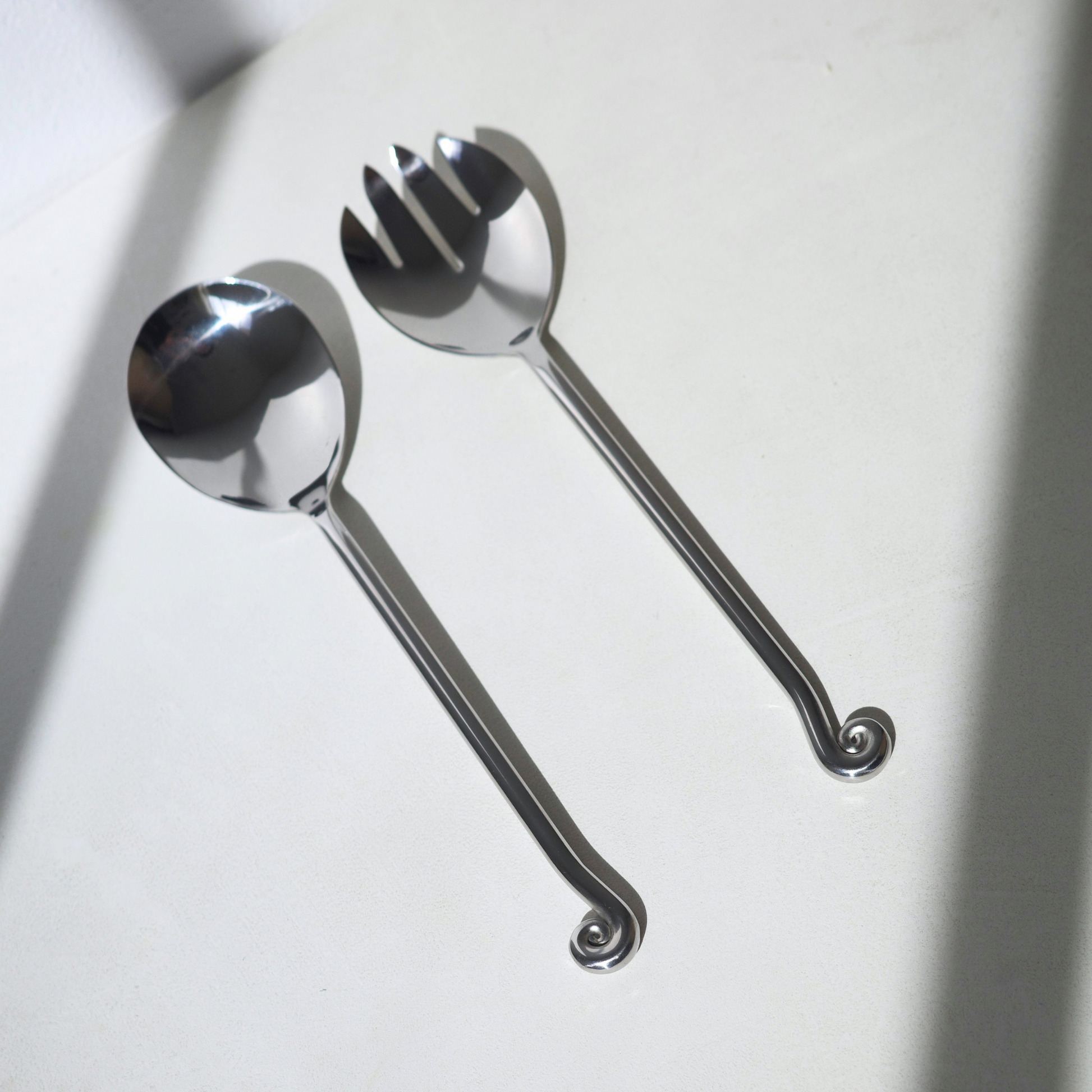Stainless steel salad servers with a spiral twisted end