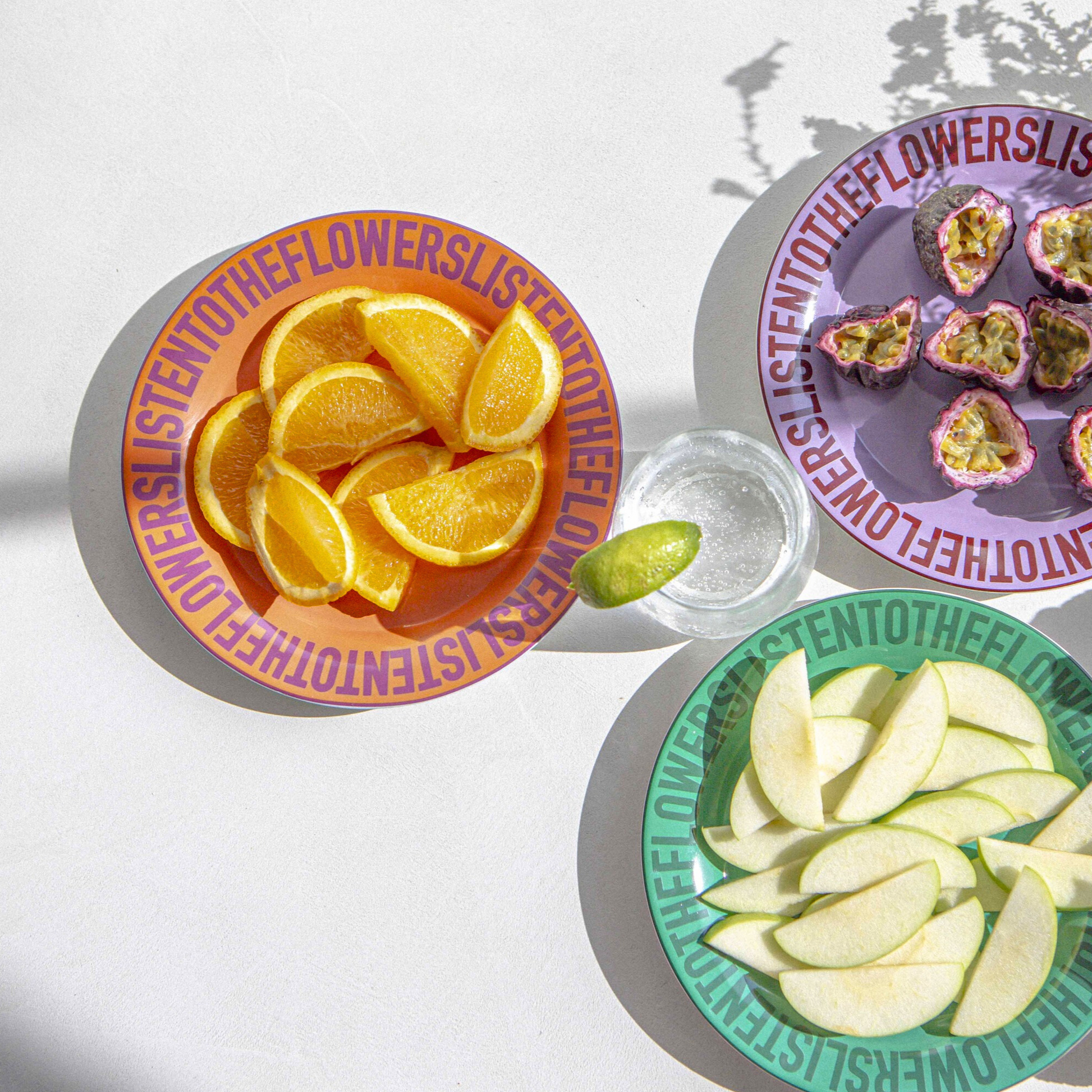 COLOURFUL CERAMIC PLATES WITH FOOD ON THEM